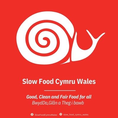 The Slow Food Cymru Wales snail logo on a red background, with the words Good, Clean and Fair Food for all